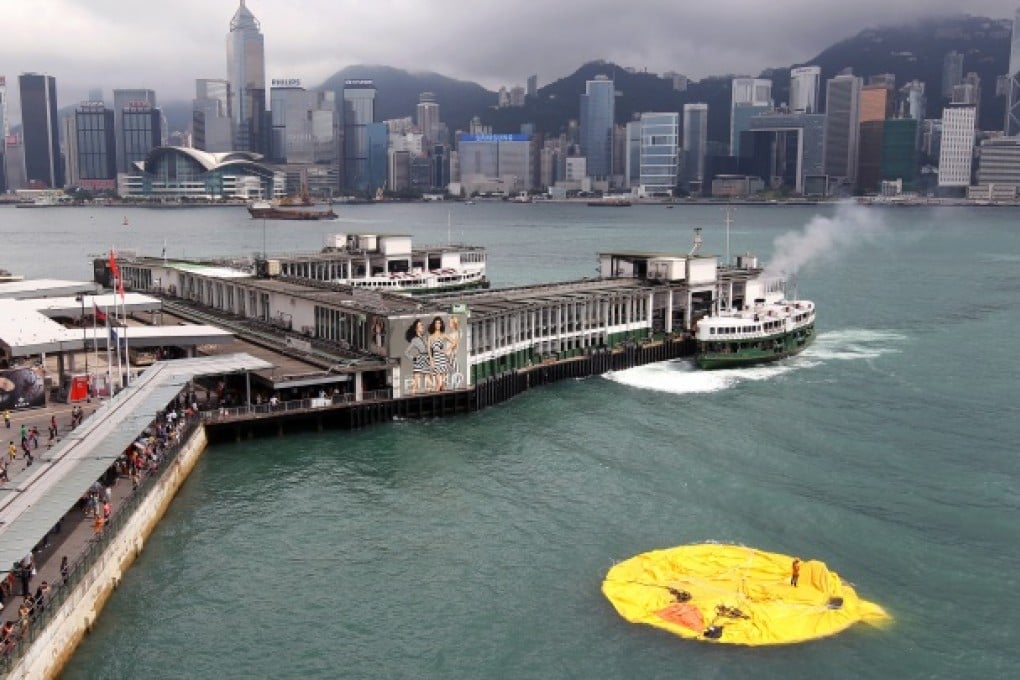 The deflated Rubber Duck by Dutch conceptual artist Florentijn Hofman floats in Hong Kong's Victoria Harbour. Photo: K.Y. Cheng