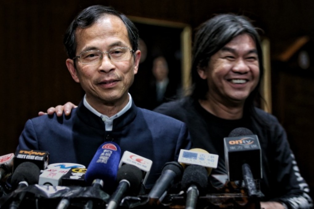 Jasper Tsang (left) receives a pat on the shoulder from "Long Hair" Leung Kwok-hung after announcing his filibuster decision. Photo: Sam Tsang