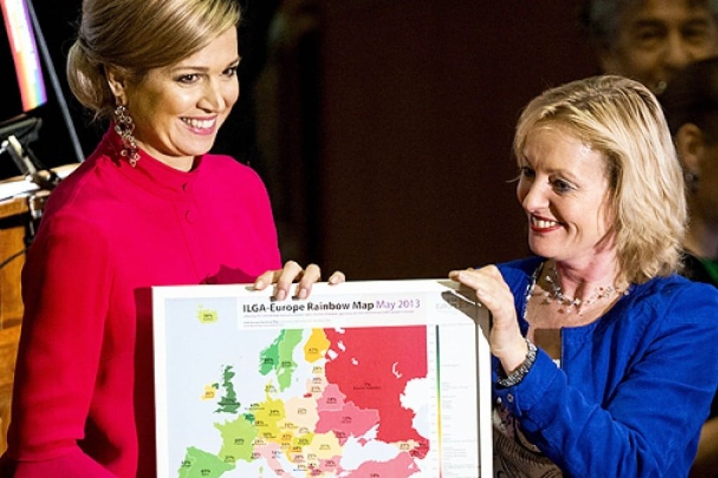 Dutch Queen Maxima (left) receives a 'Rainbow Europe Map', a tool to measure European countries' recognition of the human rights of LGBT people, from Dutch Minister for Education, Culture and Science Jet Bussemaker on Thursday. Photo: AFP
