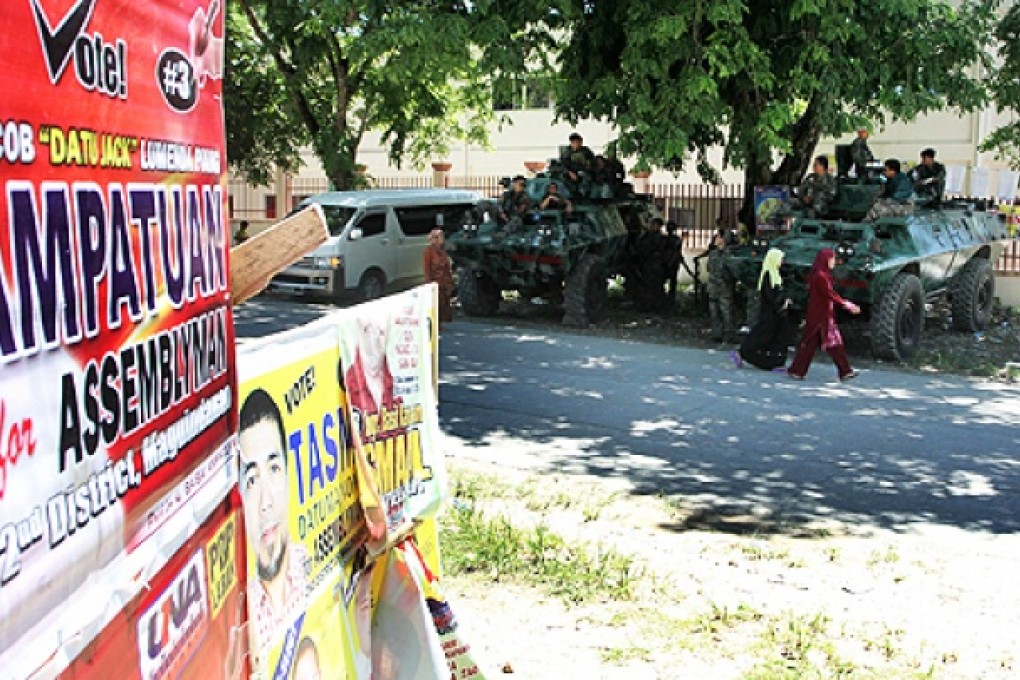 An election poster of a member of the Ampatuan clan, accused of being behind the Philippines' worst political massacre, is displayed in Shariff Aguak town, Maguindanao province, Mindanao. Photo: AFP