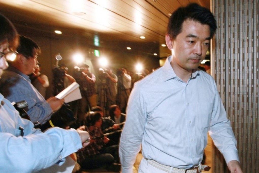 Osaka Mayor and Japan Restoration Party co-leader Toru Hashimoto leaves a press conference at Osaka city hall in Osaka. Photo: AFP