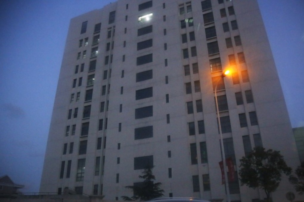 The building housing Unit 61398 of the People's Liberation Army is seen in the outskirts of Shanghai. A U.S. security firm alleged cyberattacks that stole information from 141 targets in the U.S. have been traced to the Chinese military unit in the building. Photo: AP