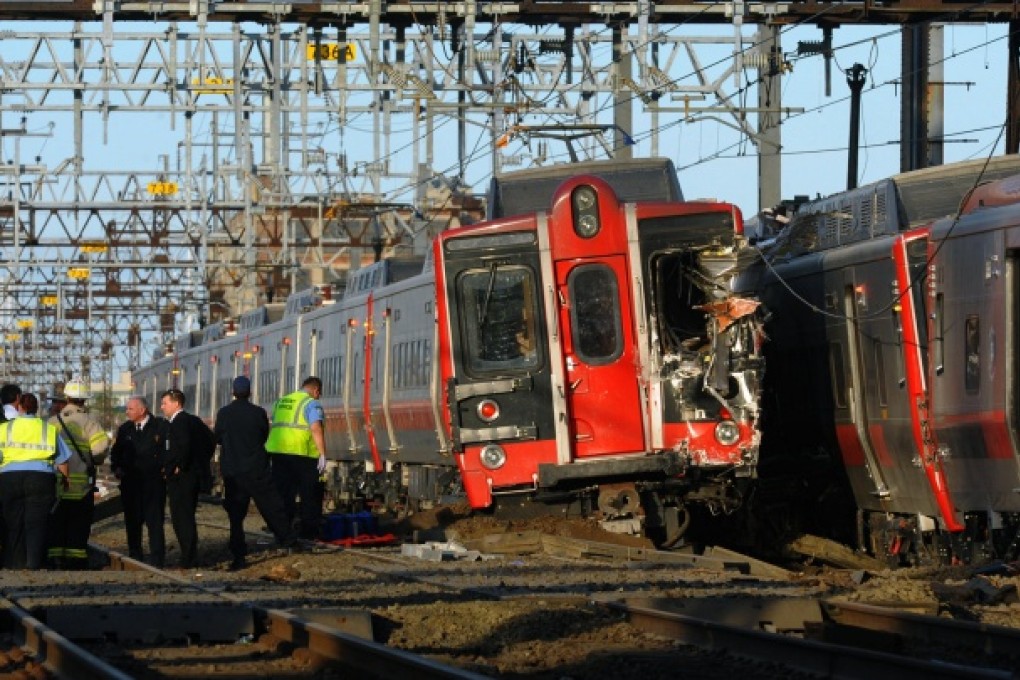 Emergency crews at the scene of the evening rush-hour collision in Bridgeport. Photo: AP/The Connecticut Post, Christian Abraham