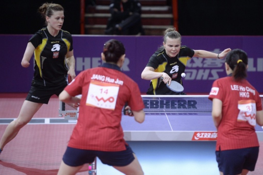 Amputee Nathalia Partyka and Katarzyna Grzybowska of Poland in action against HK's Jiang Huajun and Lee Ho-ching. Photo: EPA