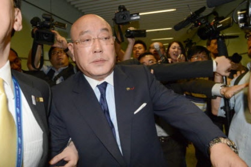 Isao Iijima passes through Beijing after his visit. Photo: AP