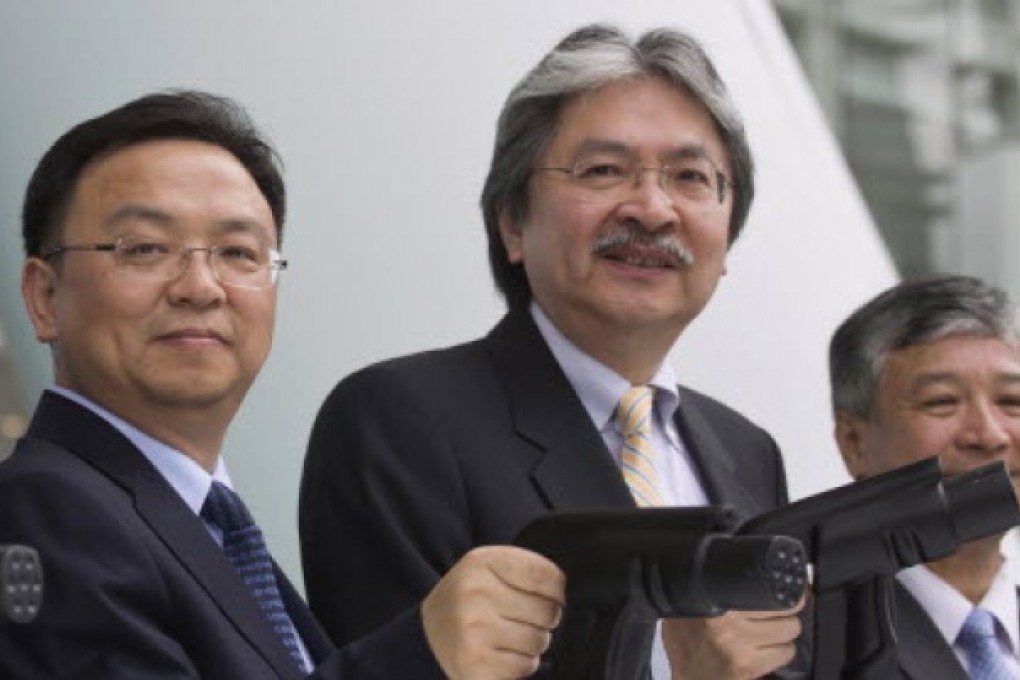 Financial Secretary John Tsang Chun-wah (centre) during a launch ceremony on Saturday of BYD e6 electric cars. Photo: Reuters