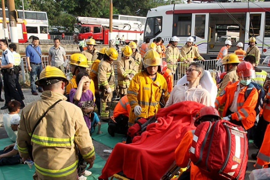 Paramedics and firefighters rushed to the accident site to help the injured. Photo: David Wong