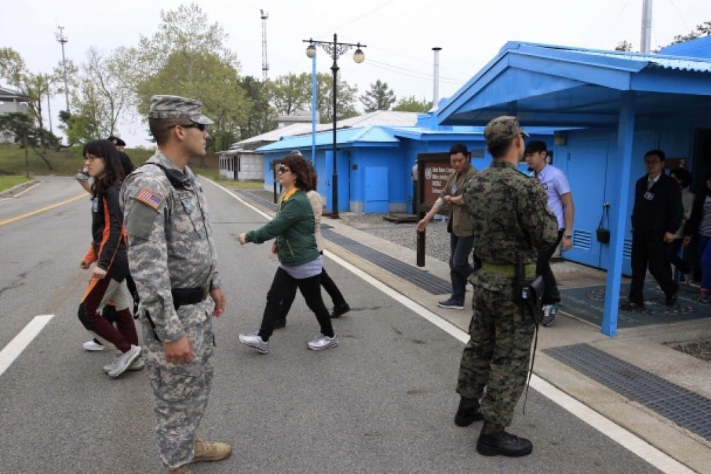Tourist in the border village of Panmunjom, which separates the two Koreas. A trip to North Korea can provide not only a valuable learning opportunity but also a unique travel experience. Photo: AP