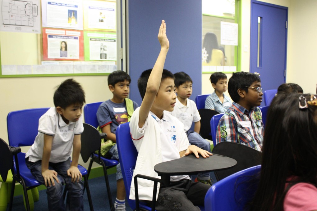 Students join a preliminary round for the Spellbulary contest.