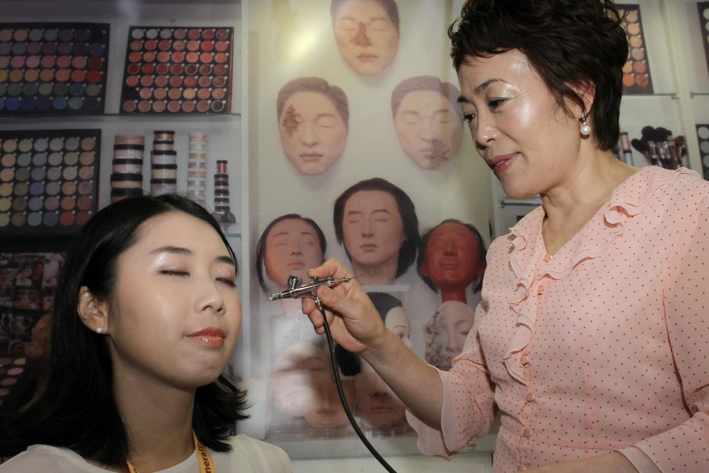 South Korean make-up artist Lee Jong-lan demonstrates her skills at the Asia Funeral and Cemetery Expo in Wan Chai. Photo: Edward Wong