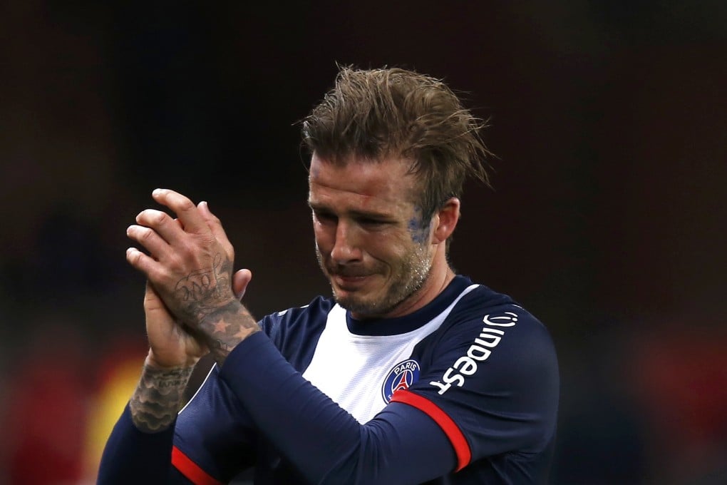A tearful David Beckham plays his final match. Photo: Reuters