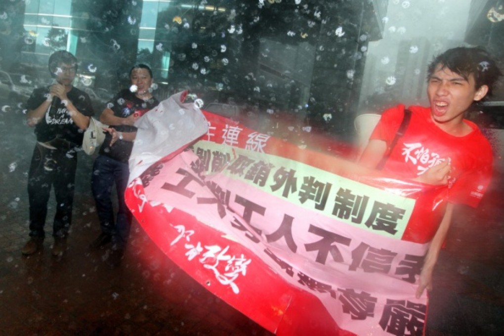 Protestors outside the meeting venue yesterday. Photo: Felix Wong