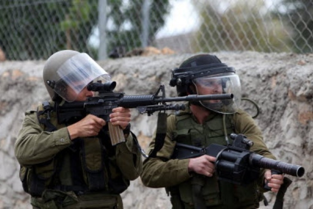 Israeli soldier, who on Tuesday while patrolling the Golan Heights, returned fire from Syria. Photo: AP