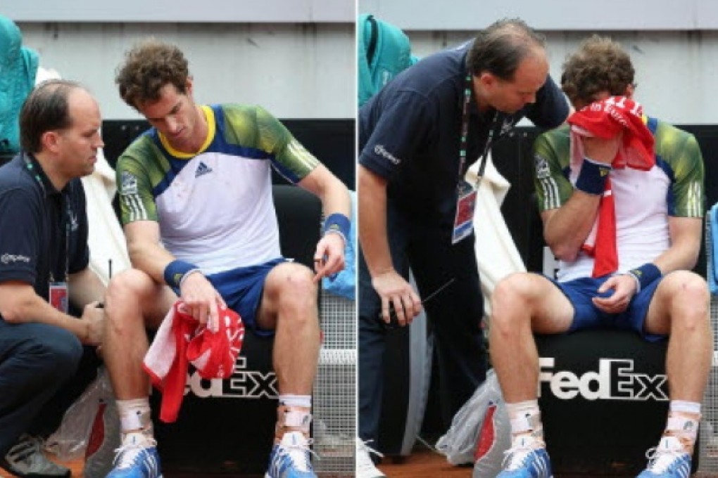 British tennis player Andy Murray (right) receiving treatment during his recent match against Spain's Marcel Granollers. Murray has pulled out of the French Open due to injury. Photo: EPA