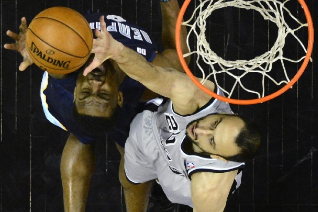 The Spurs' Manu Ginobili (right) blocks a shot by Tony Allen of the Grizzlies in game two. Photo: EPA