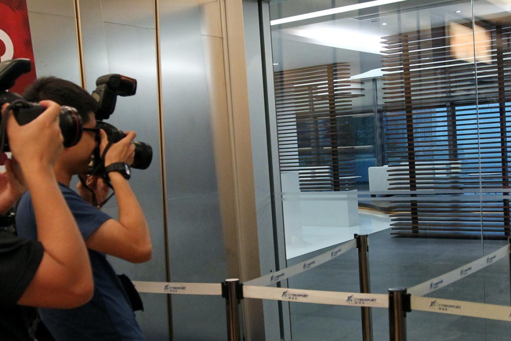The empty scenes at the Hong Kong Mercantile Exchange office at Cyberport yesterday. On Tuesday night, police took away computers from the office. Photo: May Tse