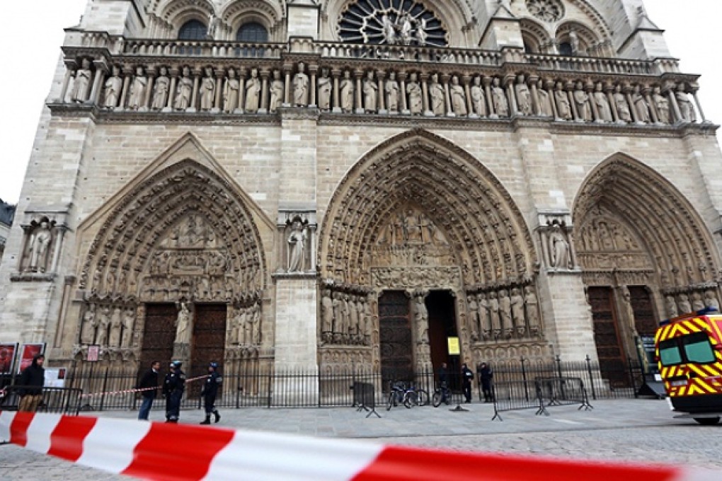 French policemen cordon off in front of Paris' Notre Dame Cathedral. Photo: AFP