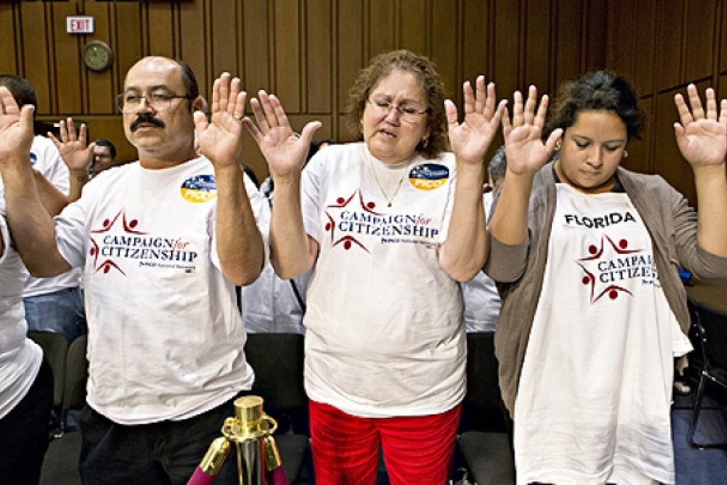 Immigration activists gather to pray on Capitol Hill in Washington, on Monday, before the Senate Judiciary Committee began work on a landmark immigration bill to secure the border and offer citizenship to millions. Photo: AP