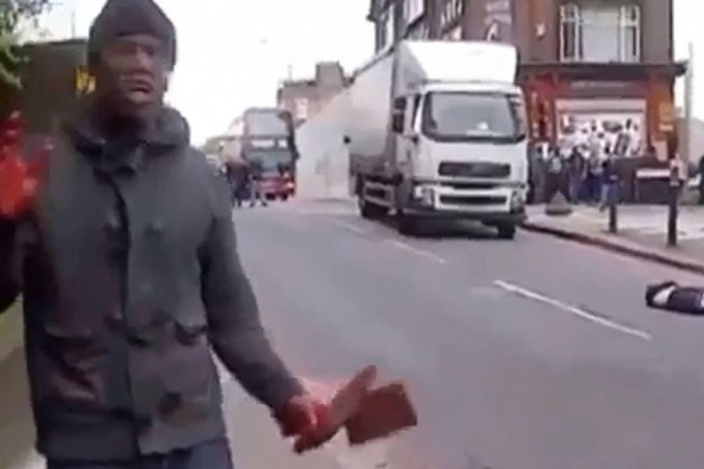 "We will never stop fighting you," one of the attackers says, as his victim lies on the road