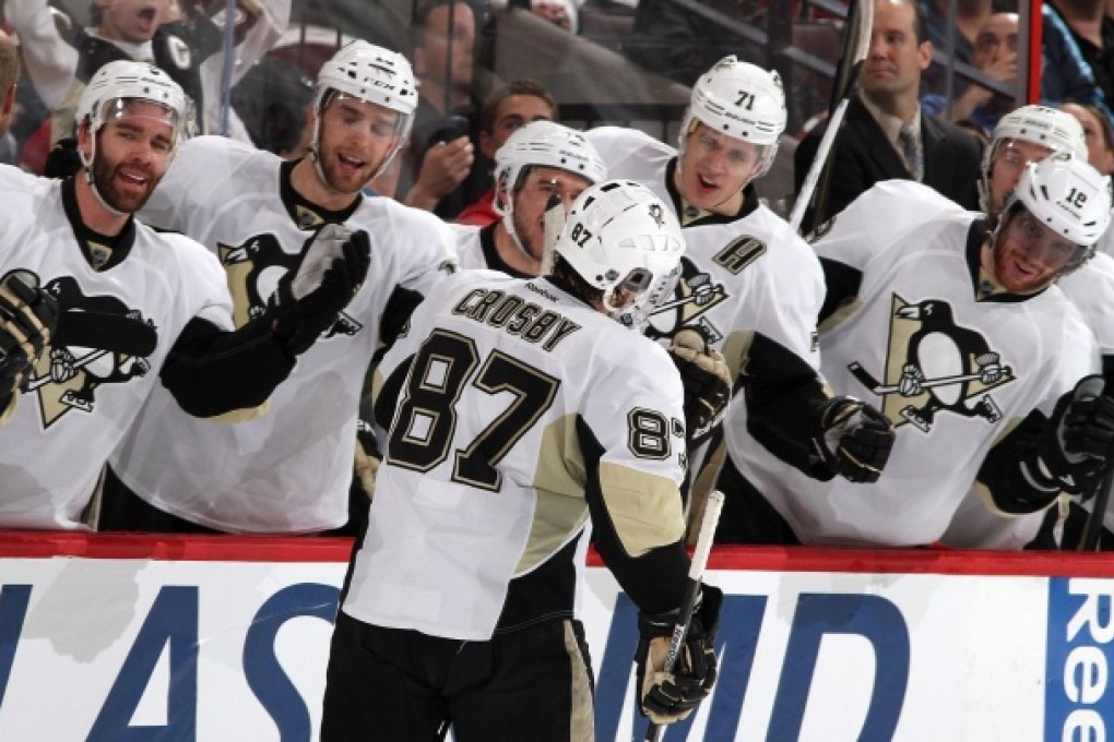 Sidney Crosby celebrates his third-period goal in Ottawa. Photo: AFP