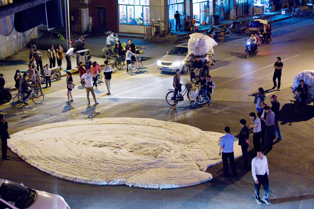 White foam erupts from Wende Road in Nanjing's Pukou district. Photo: AFP
