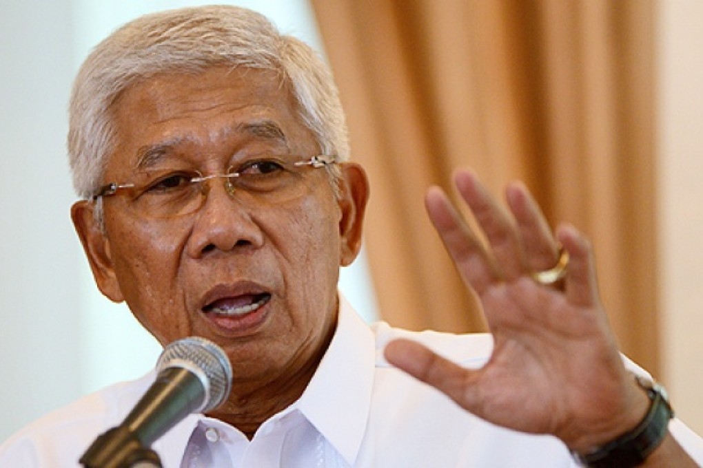 Philippines Department of National Defense Secretary Voltaire Gazmin speaks to the press in Manila on Thursday. The Philippines vowed to 'defend what is ours' as part of a stand-off over a Chinese warship circling a South China Sea reef occupied by Filipino marines. Photo: AFP