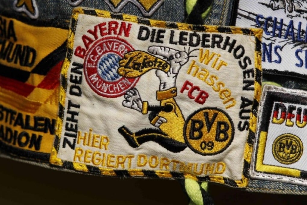 A Borussia Dortmund patch is worn by a fan as Europe braces for an all-German final. Photo: Reuters