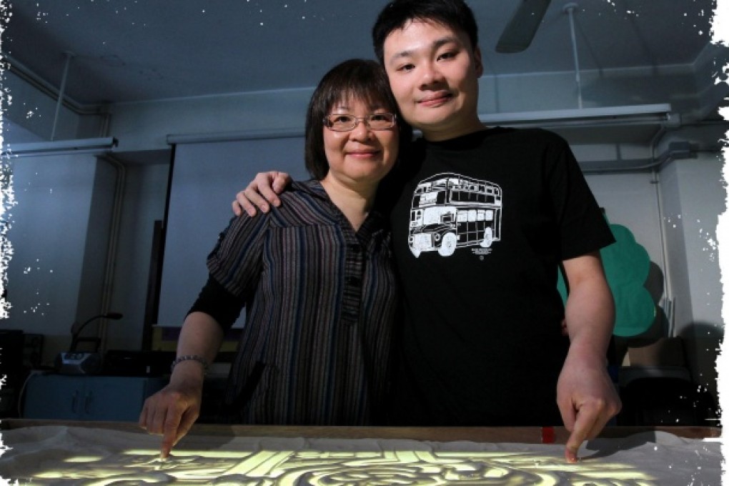 Anita Lee and her son Sai-ho with his artwork. Photo: Edward Wong