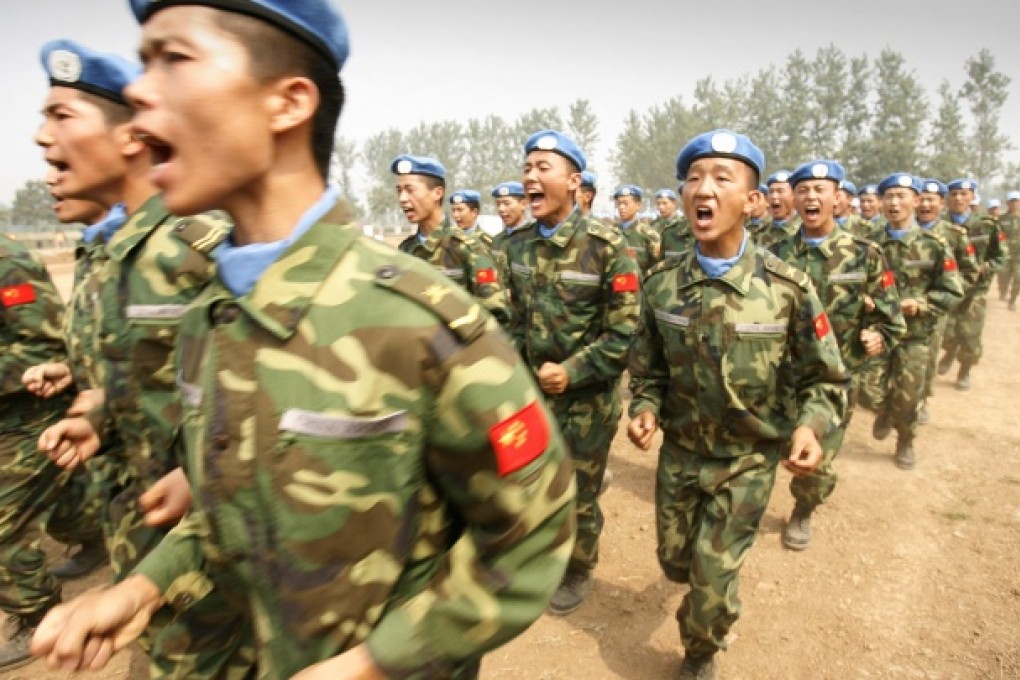 People's Liberation Army (PLA) soldiers and members of a United Nations peacekeeping unit destined for Darfur in the Sudan train at their base in Henan province, 15 September 2007. Photo: AFP