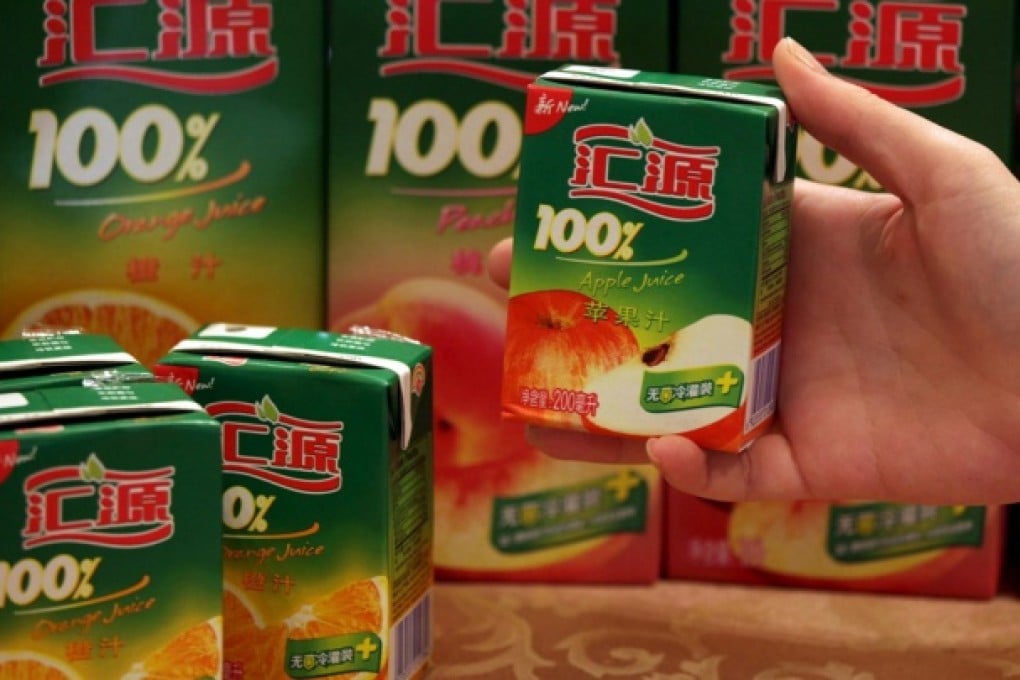 China Huiyuan Juice Group plans to acquire fruit planting and juice-concentrate-making businesses from its founder and chairman, Zhu Xinli. Photo: EPA