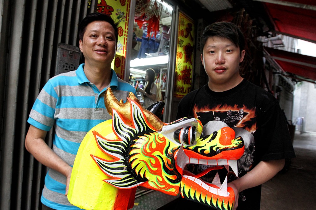 Ha Chung-kin and son San at the Sai Ying Pun shop where they are making a very special Tuen Ng festival dragon boat. Photo: Jonathan Wong