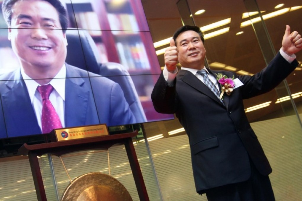 Cai Xiyou, chairman of Sinopec Engineering, at the firm's listing ceremony in Hong Kong. Photo: May Tse