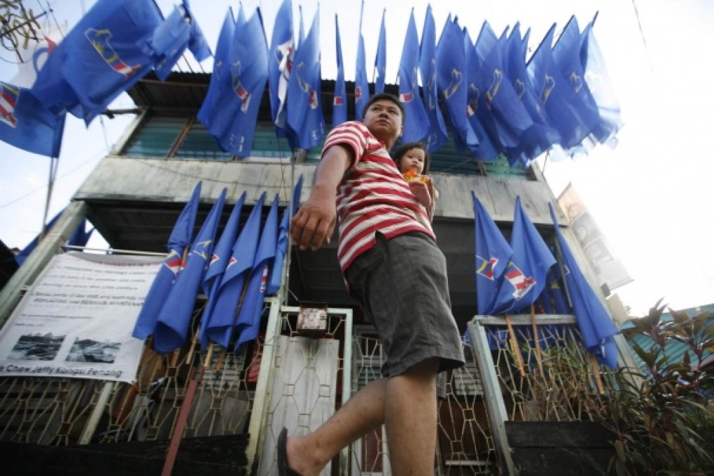 Flags of the victorious coalition fly in Georgetown. Photo: Reuters