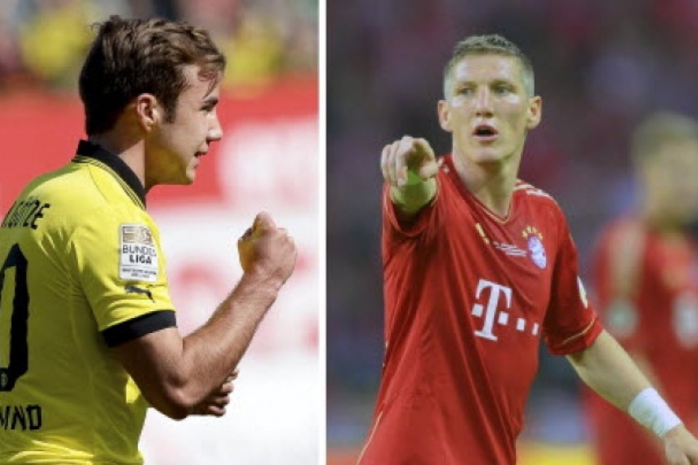 Borussia Dortmund's Mario Goetze (left) and Bayern Munich's Bastian Schweinsteiger. Photo: EPA