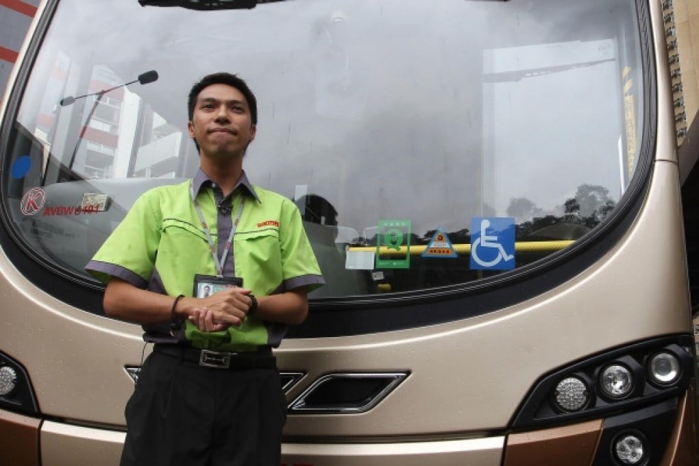Former financial analyst Gary Leung, who switched careers to become a driver for KMB and now plies the 296M route. Photo: Jonathan Wong