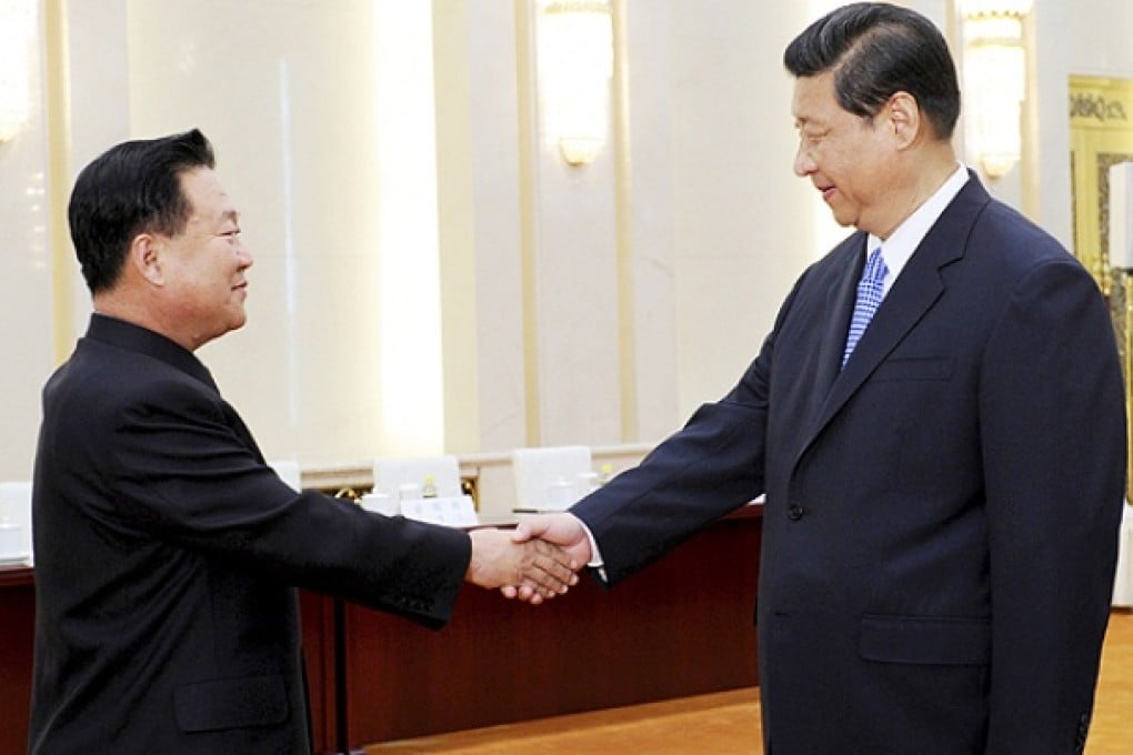 President Xi Jinping greets North Korean Vice Marshal Choe Ryong Hae in Beijing. Photo: AP