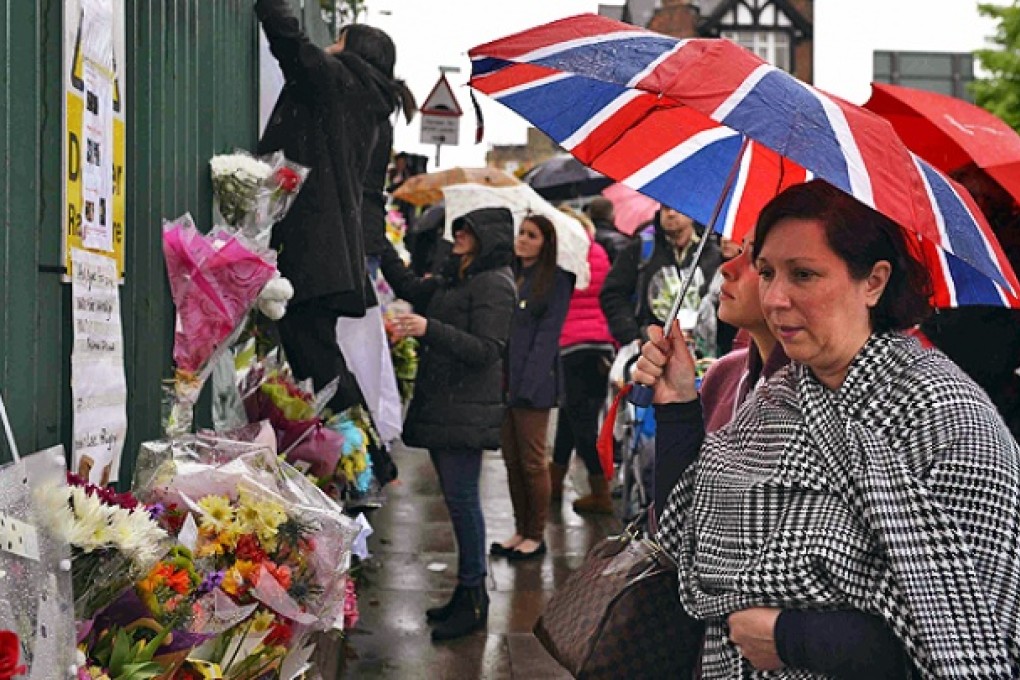 Floral tributes for Drummer Lee Rigby at the scene of his killing in Woolwich. Photo: Reuters