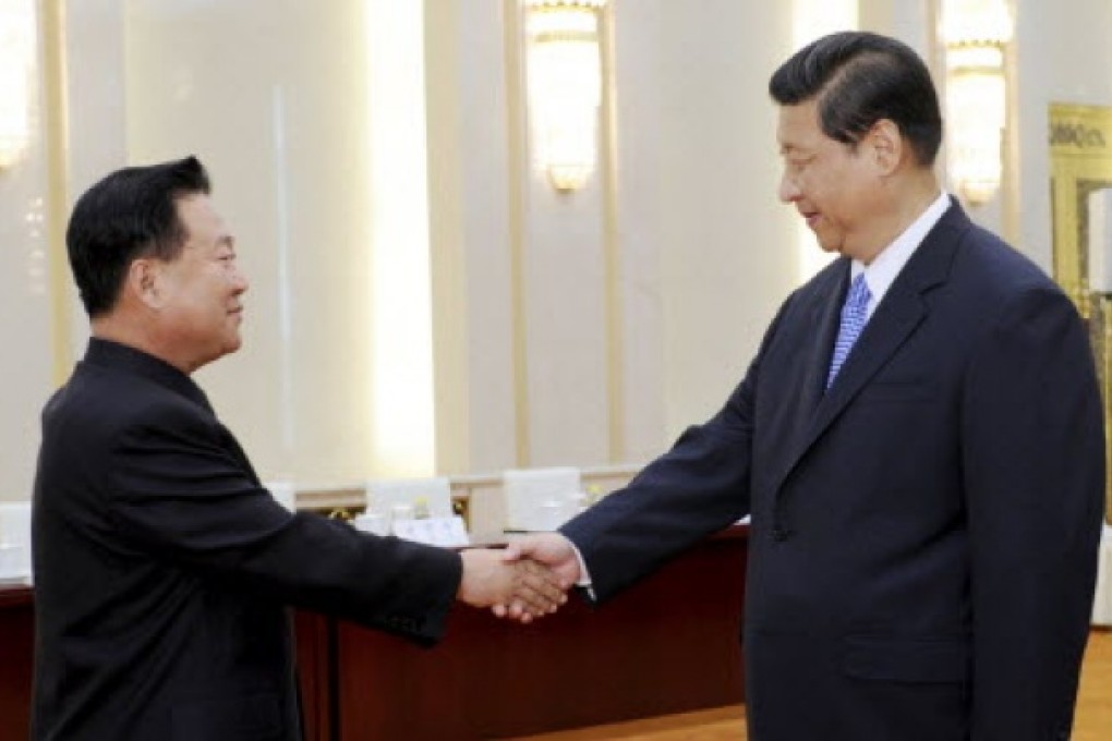 Chinese President Xi Jinping, right, greets North Korean Vice Marshal Choe Ryong Hae in Beijing. Photo: AP