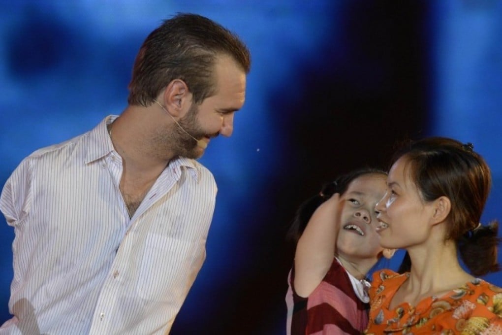 Nick Vujicic's message has resonance in a country blighted by disabilities after wartime US chemical bombardment. Photo: AFP