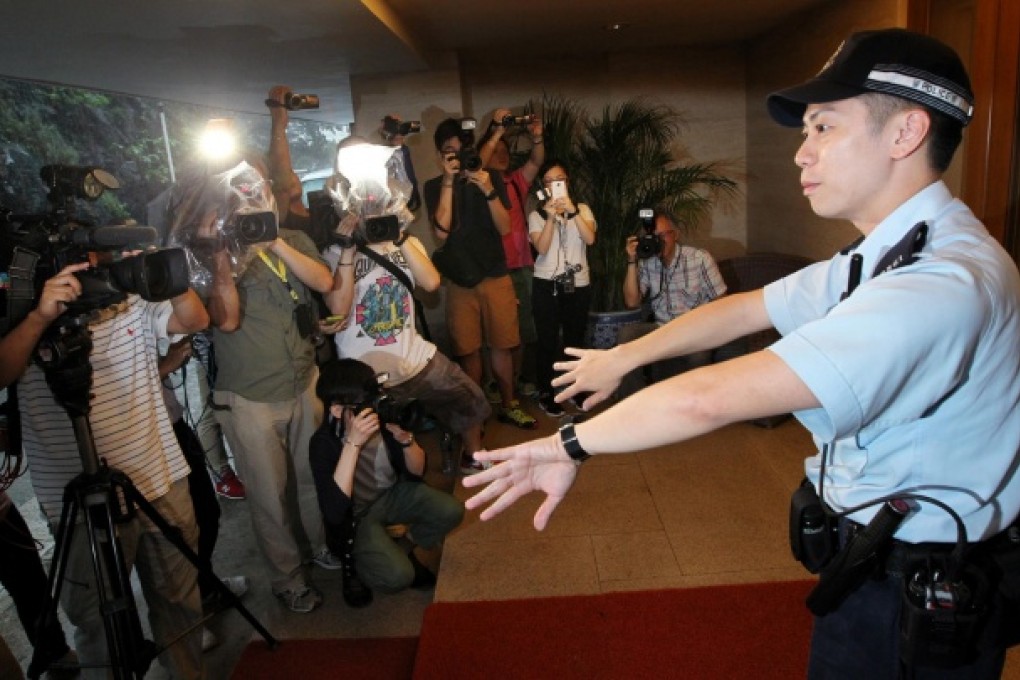 Police are called to control a media scrum outside the home of HKMEx founder Barry Cheung in Repulse Bay. Photo: Nora Tam