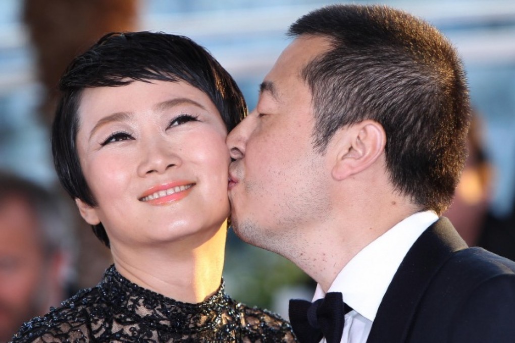 Jia Zhangke and wife Zhao Tao after being awarded Best Screenplay.