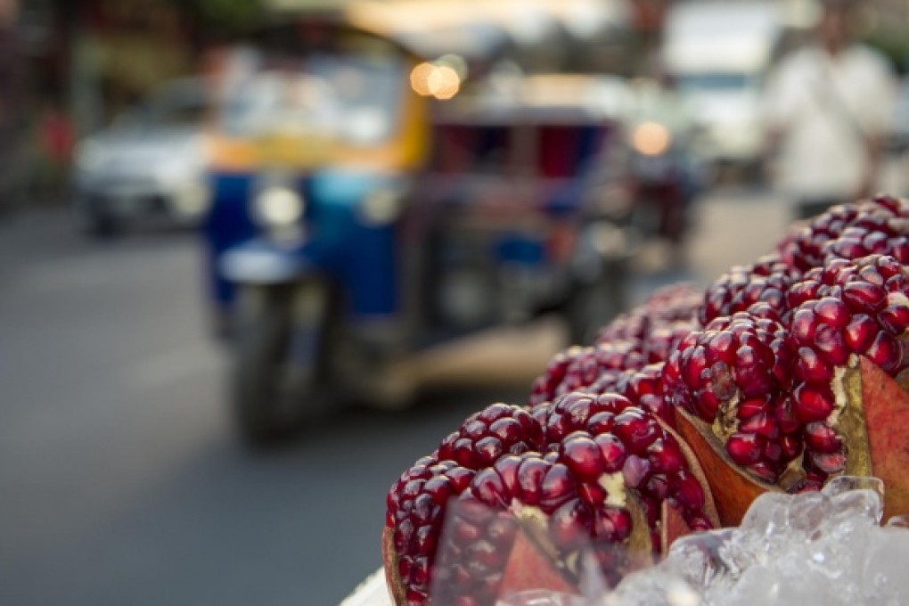 Pomegranates for sale at a street food stall in Bangkok's Chinatown. Photos: Gavin Gough