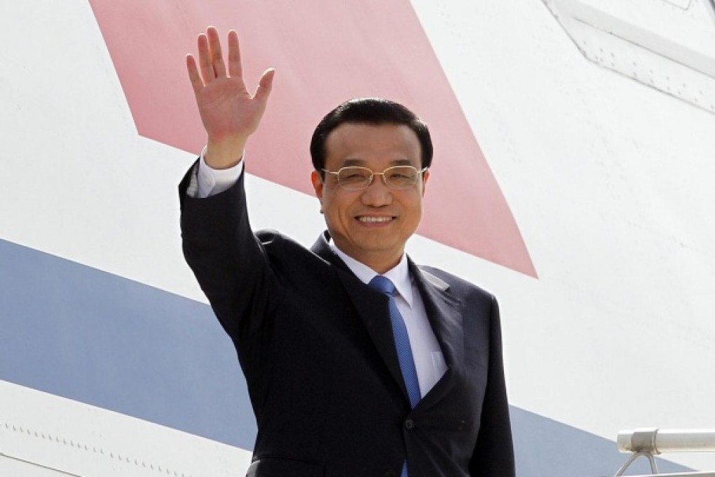 Premier Li Keqiang arrives in New Delhi. At an official dinner there he surprised his hosts by ordering a vegetarian meal. Photo: EPA