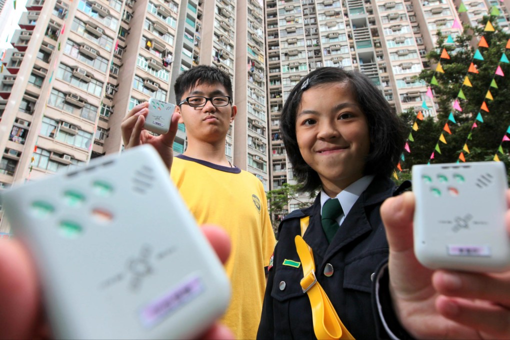 Students So Tak-sang (left) and Lily Wong Ka-lai with their GPS devices. Photo: Felix Wong