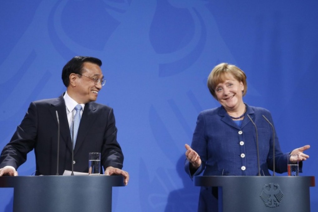 Li Keqiang and Angela Merkel address a news conference after talks in Berlin yesterday in which trade issues dominated. Photo: Reuters