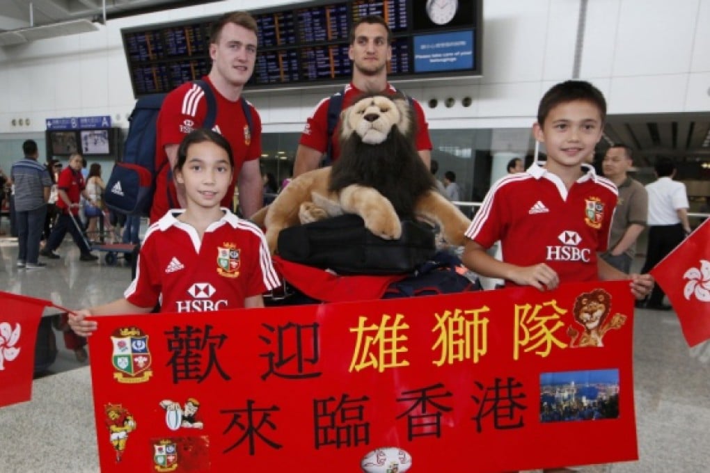 Fans greet Lions Stuart Hogg and Sam Warburton. Photo: AP
