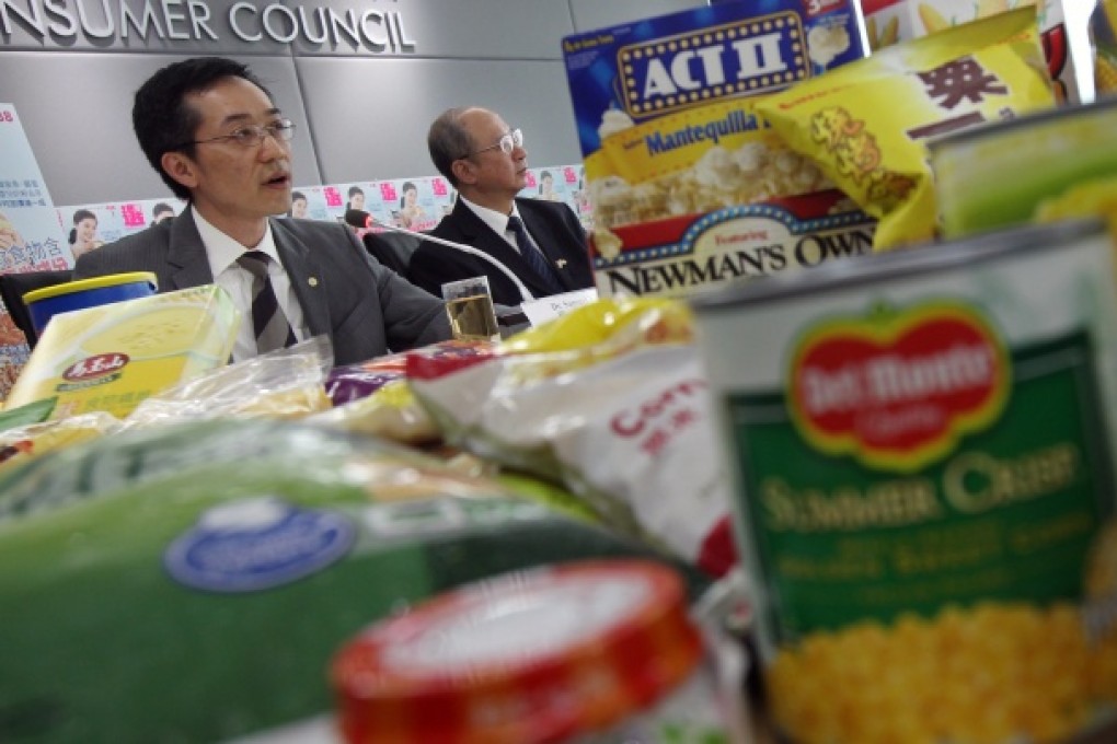 Officials from the Centre for Food Safety and the Consumer Council speak to the media regarding latest test findings on genetically modified corn ingredients in prepackaged food. Photo: David Wong