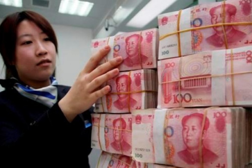 China has eased controls on the yuan to gradually increase the global use of the currency, which has risen to a record high. Photo: Xinhua