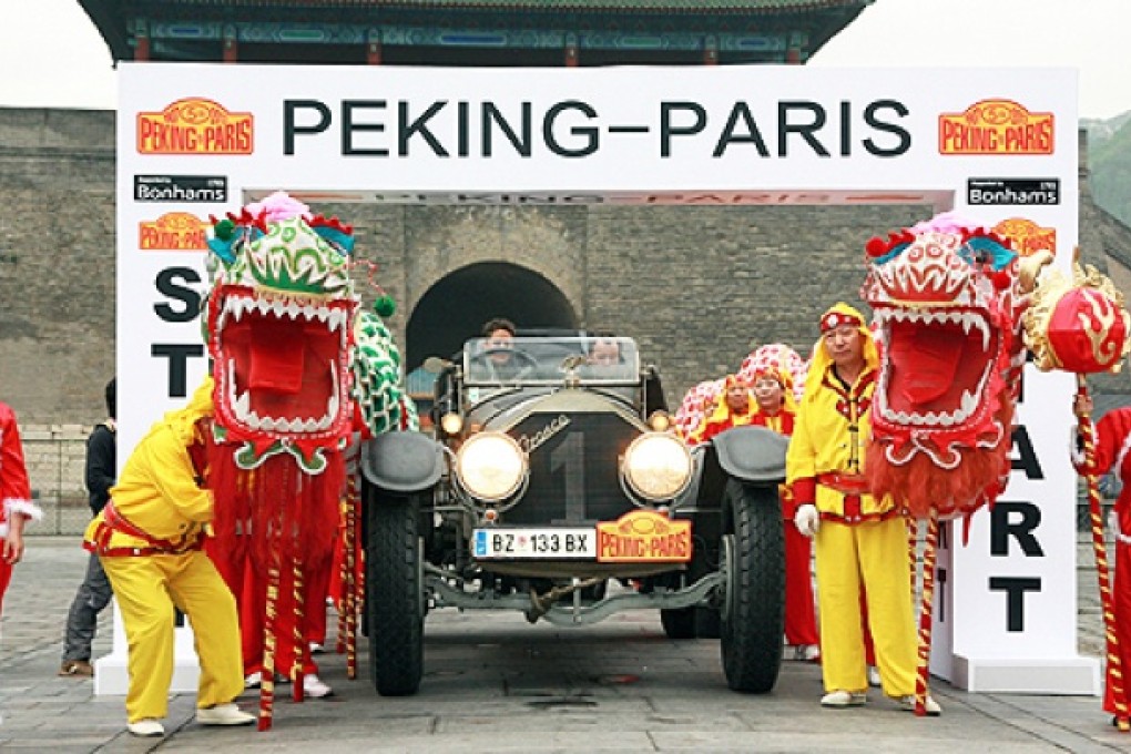 A vintage car prepares to be flagged off from the Great Wall of China at Juyongguan in the suburbs of Beijing on Tuesday. Photo: AFP