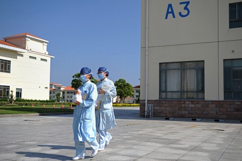 Nurses leave a bird flu isolation unit at a hospital in Shanghai. Photo: AFP
